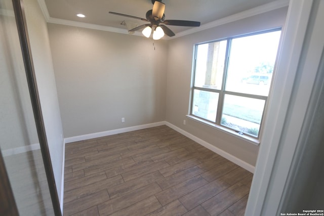 spare room featuring crown molding, hardwood / wood-style floors, and ceiling fan