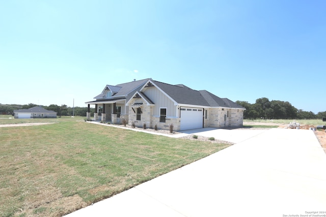 view of front facade featuring a garage and a front lawn