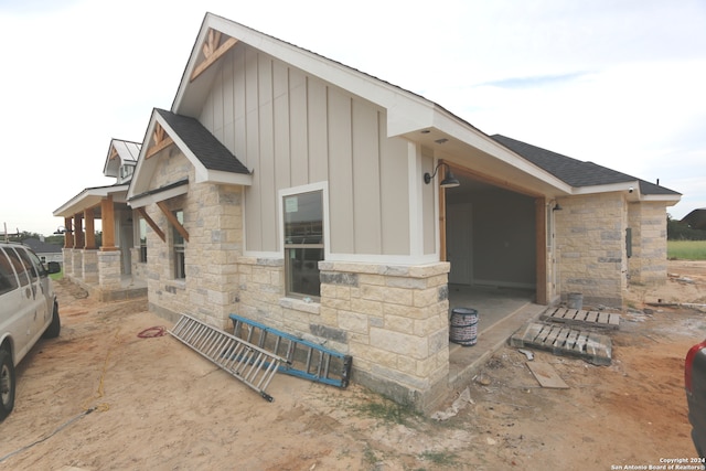 view of side of home featuring a patio area