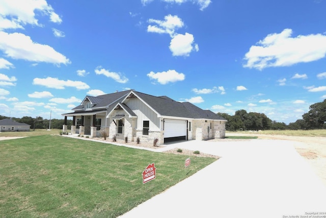 craftsman-style house with a garage, a front lawn, and a porch