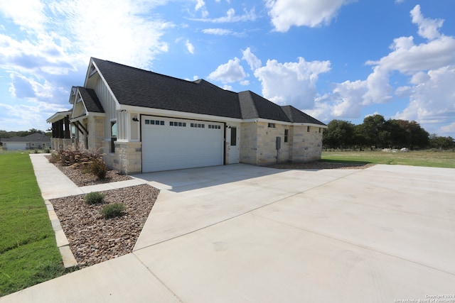 view of side of home with a garage