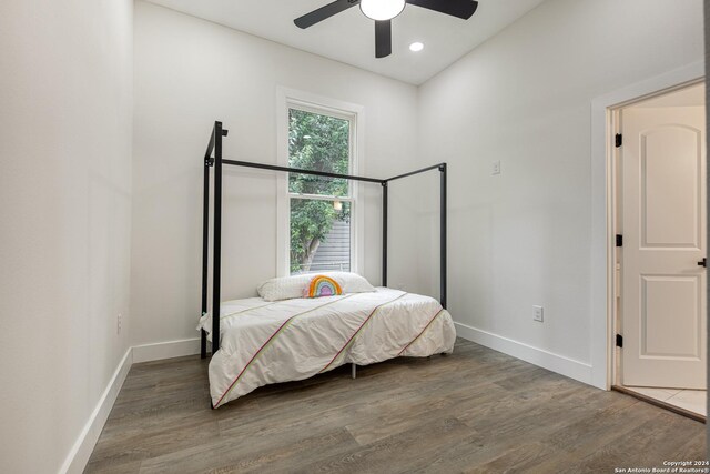 bedroom featuring ceiling fan and hardwood / wood-style floors