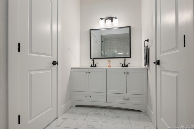 bathroom featuring double vanity and tile patterned floors