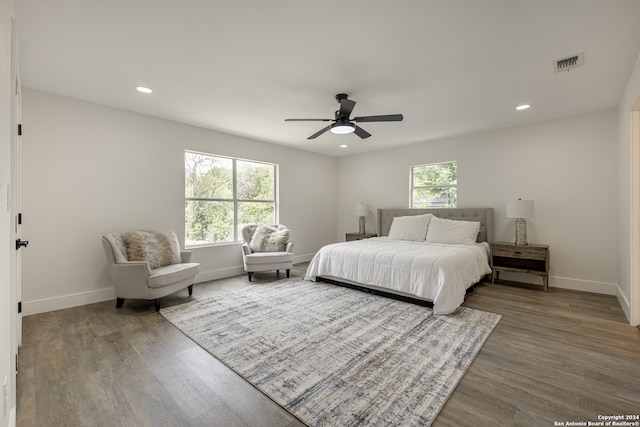 bedroom featuring ceiling fan and wood-type flooring