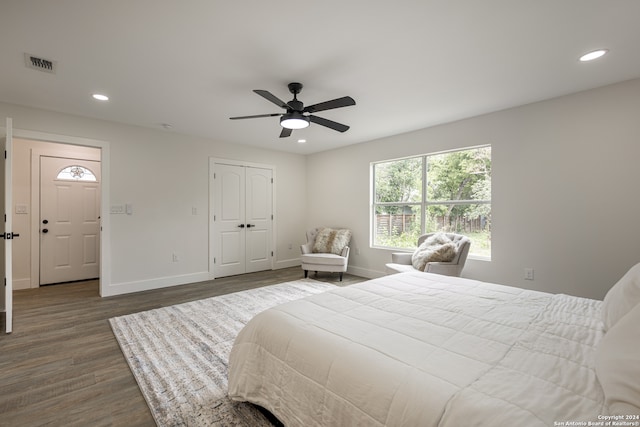 bedroom featuring ceiling fan, hardwood / wood-style floors, and a closet