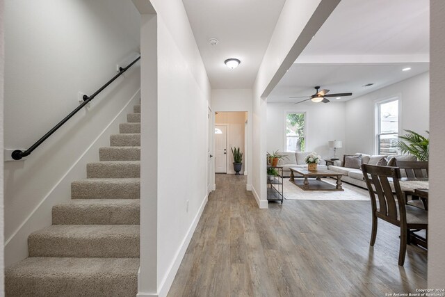 entryway with light wood-type flooring and ceiling fan