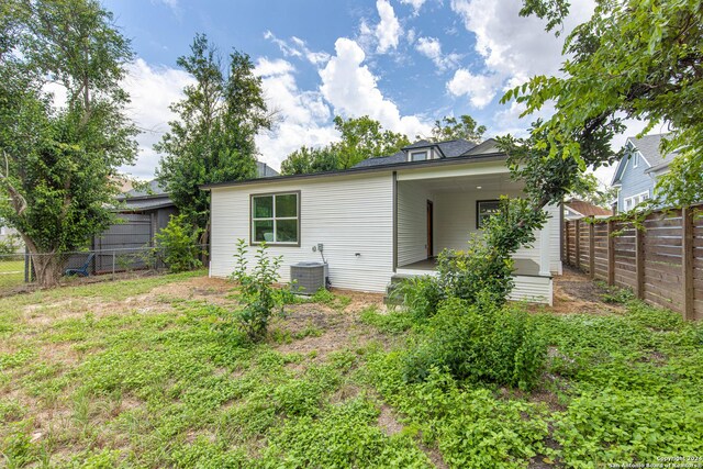 back of property with central air condition unit