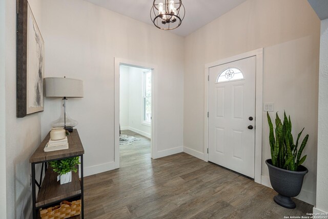 living room featuring ceiling fan and hardwood / wood-style flooring