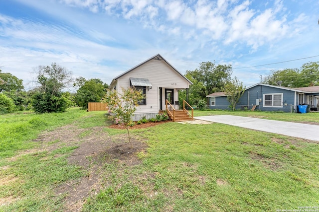 view of front of property with a front lawn