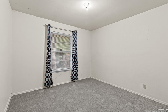 unfurnished room with carpet floors