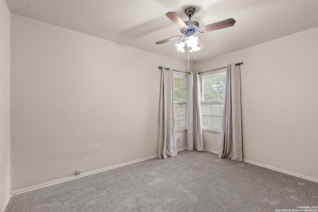 carpeted empty room with ceiling fan