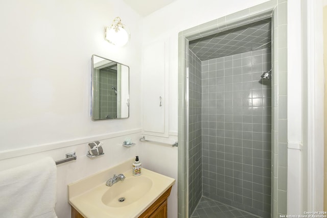 bathroom featuring vanity and a tile shower