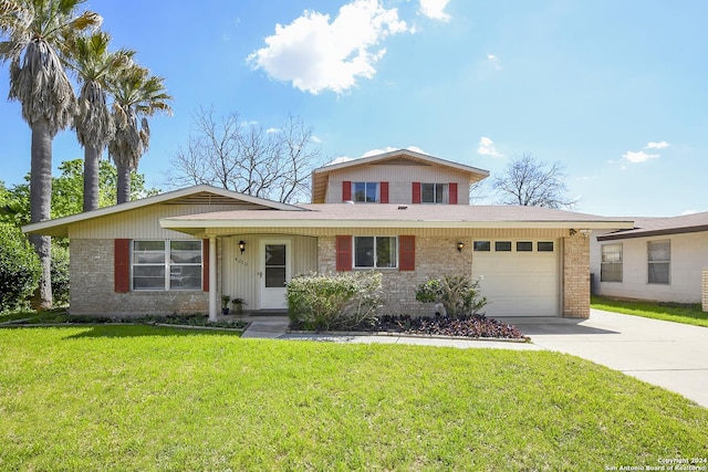 view of front facade with a garage and a front yard