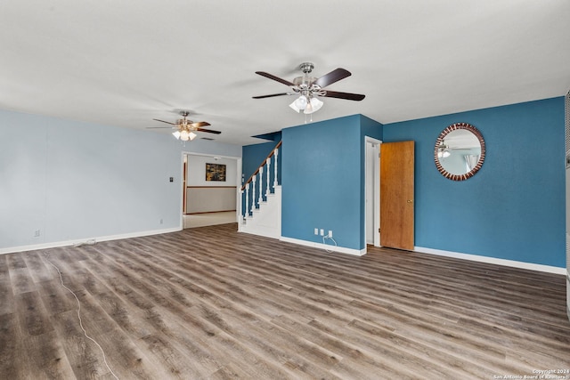 unfurnished living room featuring ceiling fan and hardwood / wood-style floors