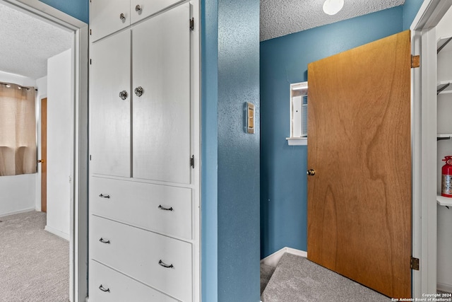 interior space with a textured ceiling