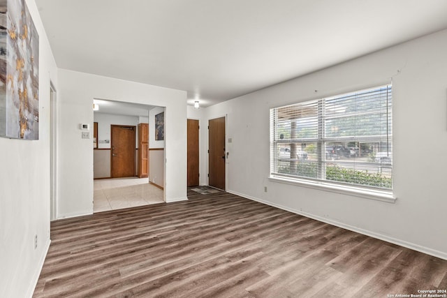 empty room with wood-type flooring