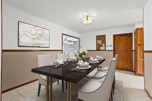 dining space featuring light tile patterned floors and a textured ceiling