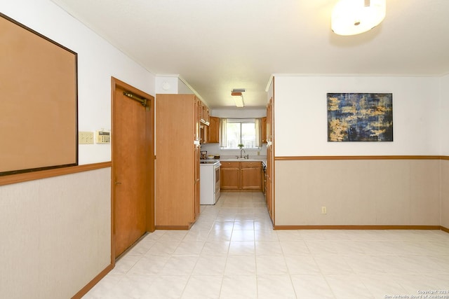 hall featuring ornamental molding and sink