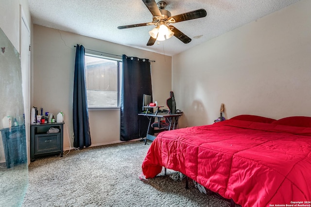 carpeted bedroom with a textured ceiling and ceiling fan