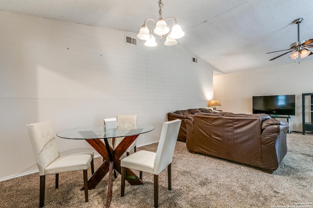 carpeted dining room with lofted ceiling, ceiling fan with notable chandelier, and a textured ceiling