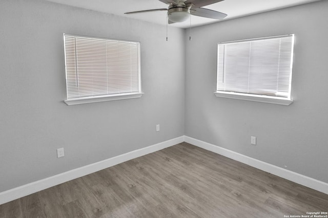 empty room featuring hardwood / wood-style floors and ceiling fan