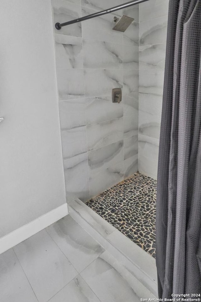 bathroom with a shower with curtain