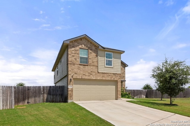 front facade with a garage and a front yard