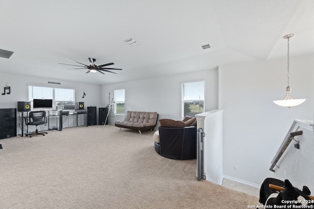 living room with light carpet and ceiling fan