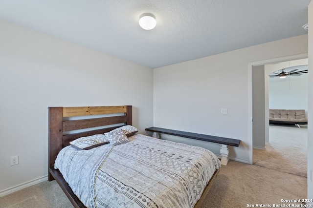 bedroom featuring light carpet