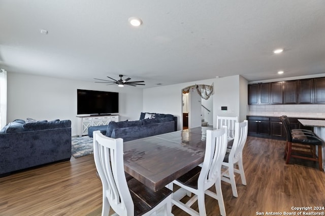 dining room featuring ceiling fan and hardwood / wood-style flooring