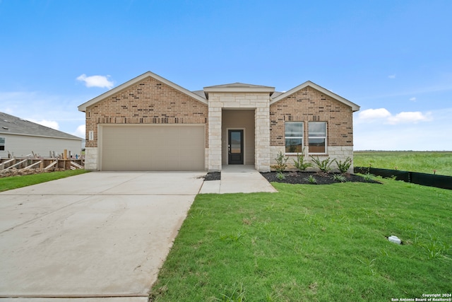 view of front of home featuring a garage and a front yard