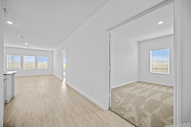 interior space featuring a healthy amount of sunlight and light hardwood / wood-style flooring