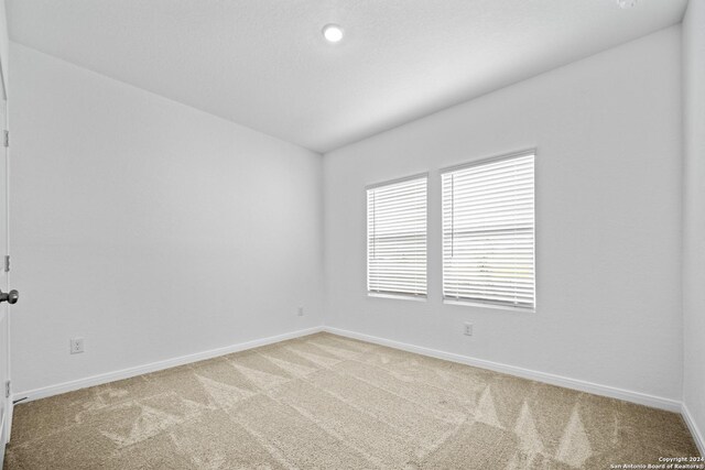 empty room with light carpet