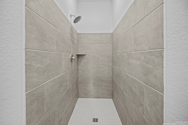 bathroom with a tile shower