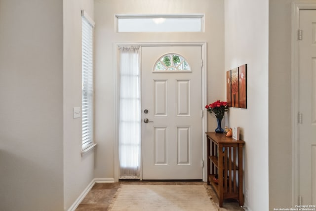 foyer entrance with light tile patterned floors