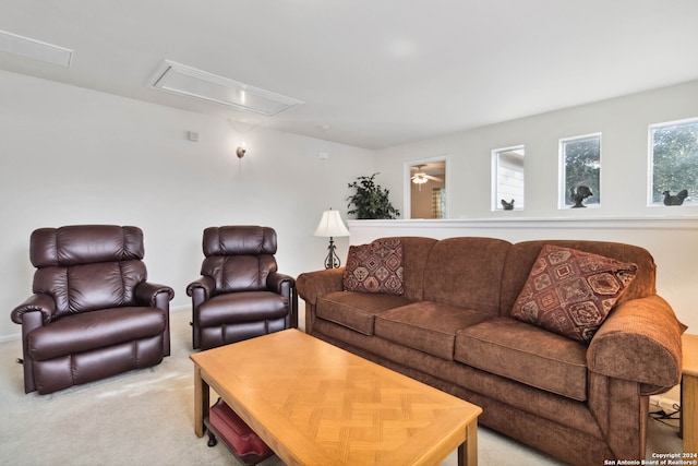 living room featuring light colored carpet and ceiling fan