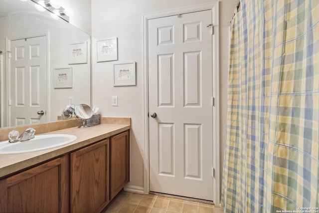 bathroom with vanity and tile patterned floors