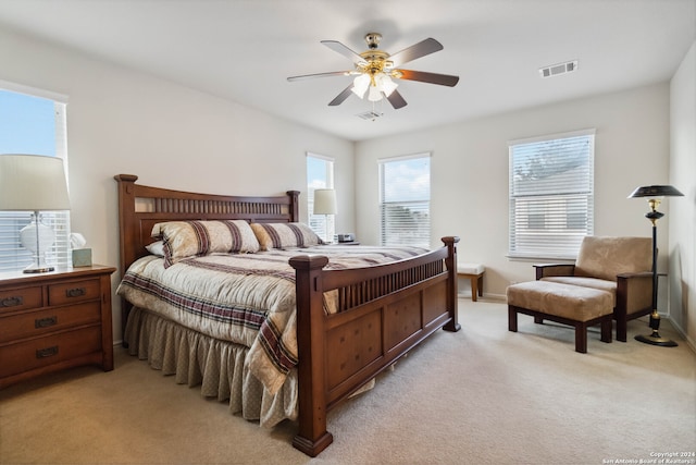 bedroom featuring ceiling fan and light colored carpet