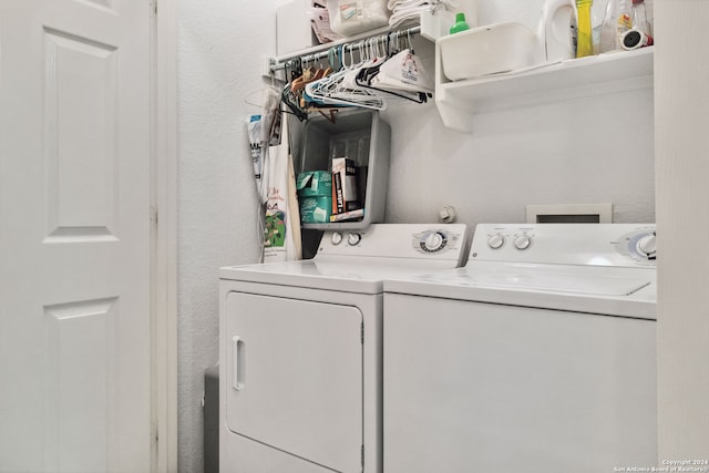 laundry room with independent washer and dryer