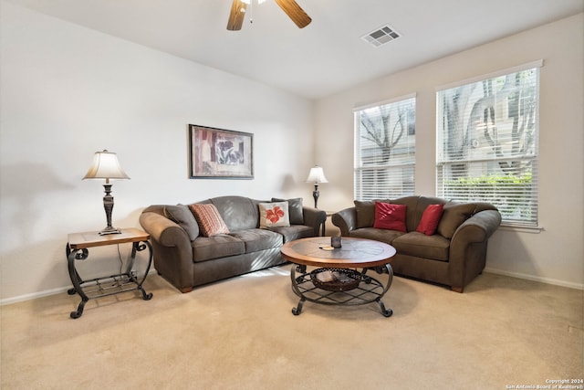 living room featuring light carpet and ceiling fan