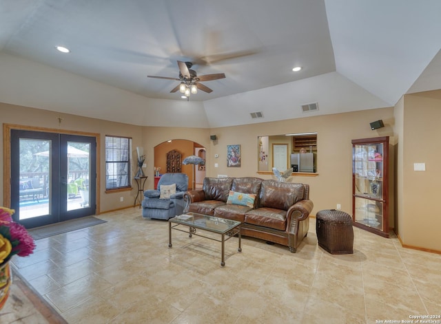 living room featuring vaulted ceiling, ceiling fan, and french doors