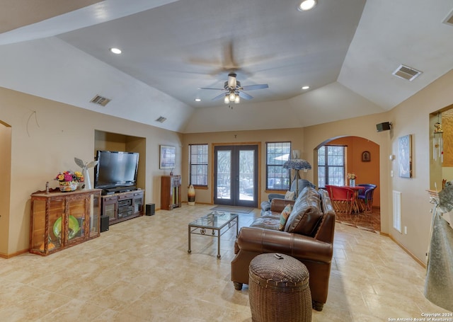 living room with lofted ceiling, french doors, and ceiling fan