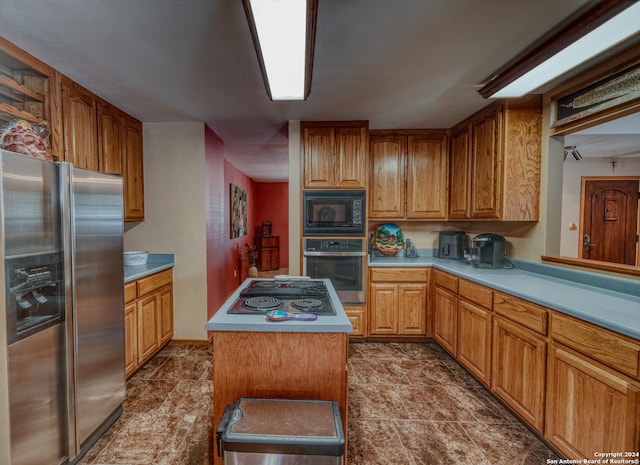 kitchen with stainless steel appliances and a kitchen island