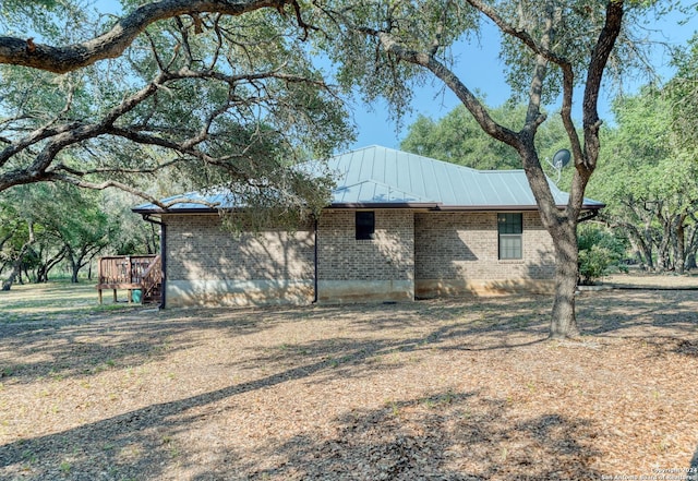 view of side of property featuring a deck