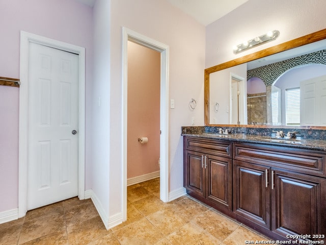 bathroom with vanity and tile patterned flooring