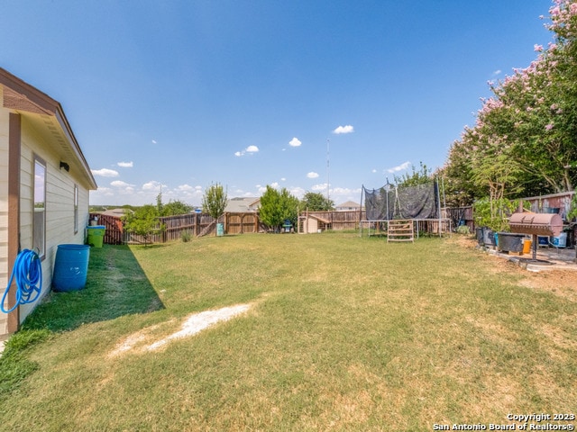 view of yard with a trampoline