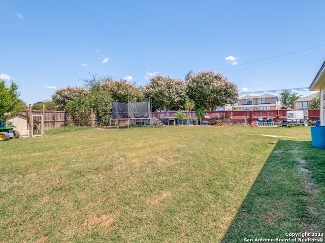 view of yard with a trampoline