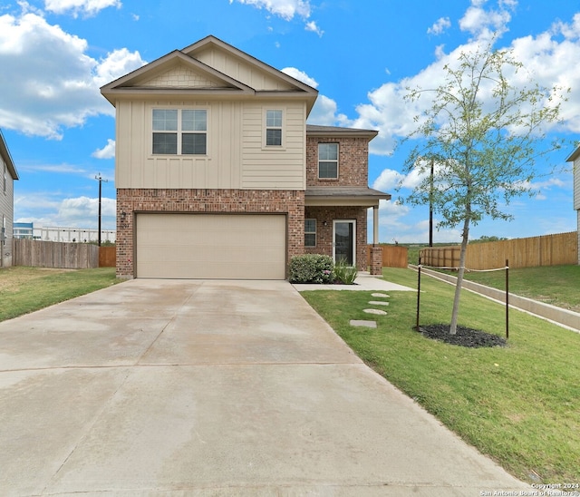 view of front of home featuring a garage and a front lawn