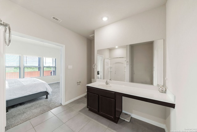 bathroom featuring tile patterned floors and vanity