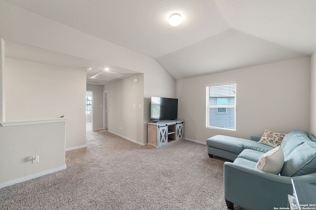 carpeted living room featuring a healthy amount of sunlight and vaulted ceiling